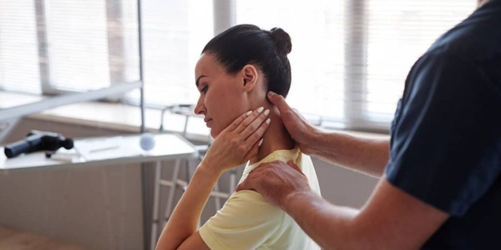 Chiropractor treating a patient with repetitive strain injury using hands-on therapy to relieve pain and improve mobility | Chiropractor for Repetitive Strain Injury