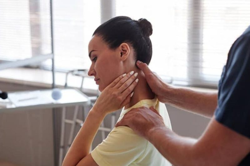 Chiropractor treating a patient with repetitive strain injury using hands-on therapy to relieve pain and improve mobility | Chiropractor for Repetitive Strain Injury